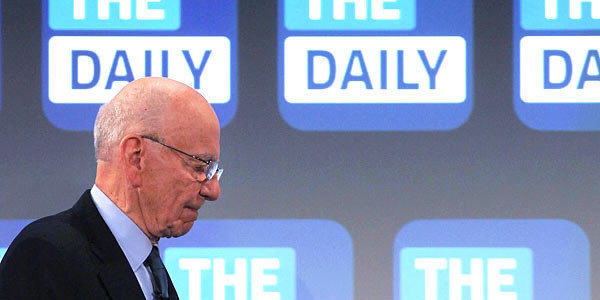 The Daily will cease publication Dec. 15. Some of its staff will be moved to the New York Post. Above, News Corp. CEO Rupert Murdoch walks on stage at the Guggenheim Museum in New York last year for the news app's launch.