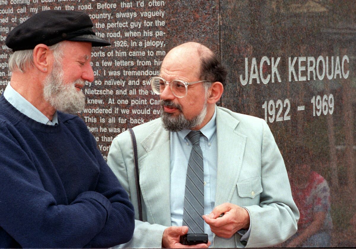 Poets Lawrence Ferlinghetti, left, and Allen Ginsberg chat during the dedication of the Jack Kerouac Commemorative, a work of public art, in Lowell Mass. on June 25, 1988.
