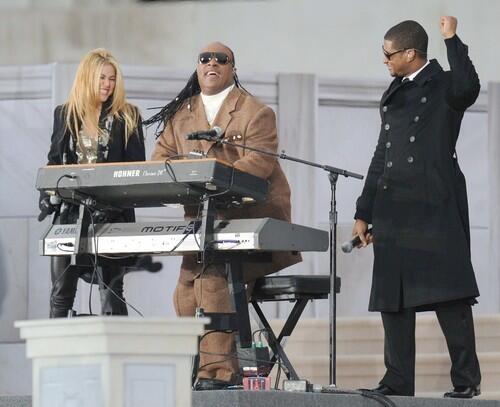 Stevie Wonder, center, performs with Shakira and Usher at the We Are One concert at the Lincoln Memorial.