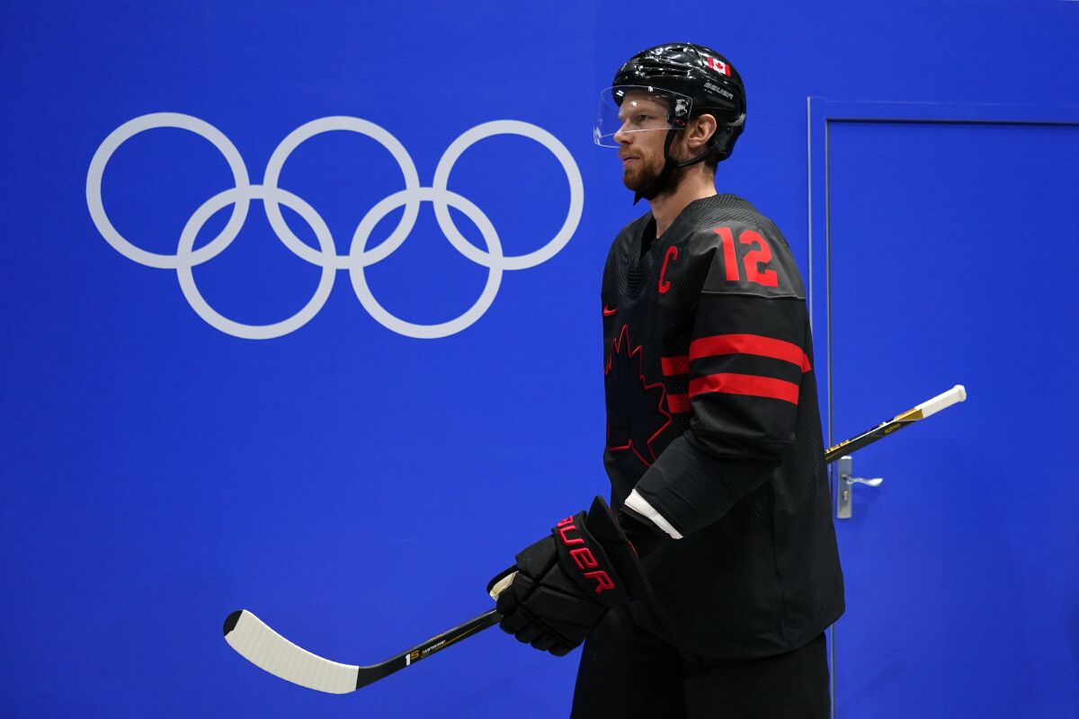 Canada's Eric Staal walks to the ice for a men's qualification round hockey game against China at the 2022 Winter Olympics, Tuesday, Feb. 15, 2022, in Beijing. (AP Photo/Matt Slocum)