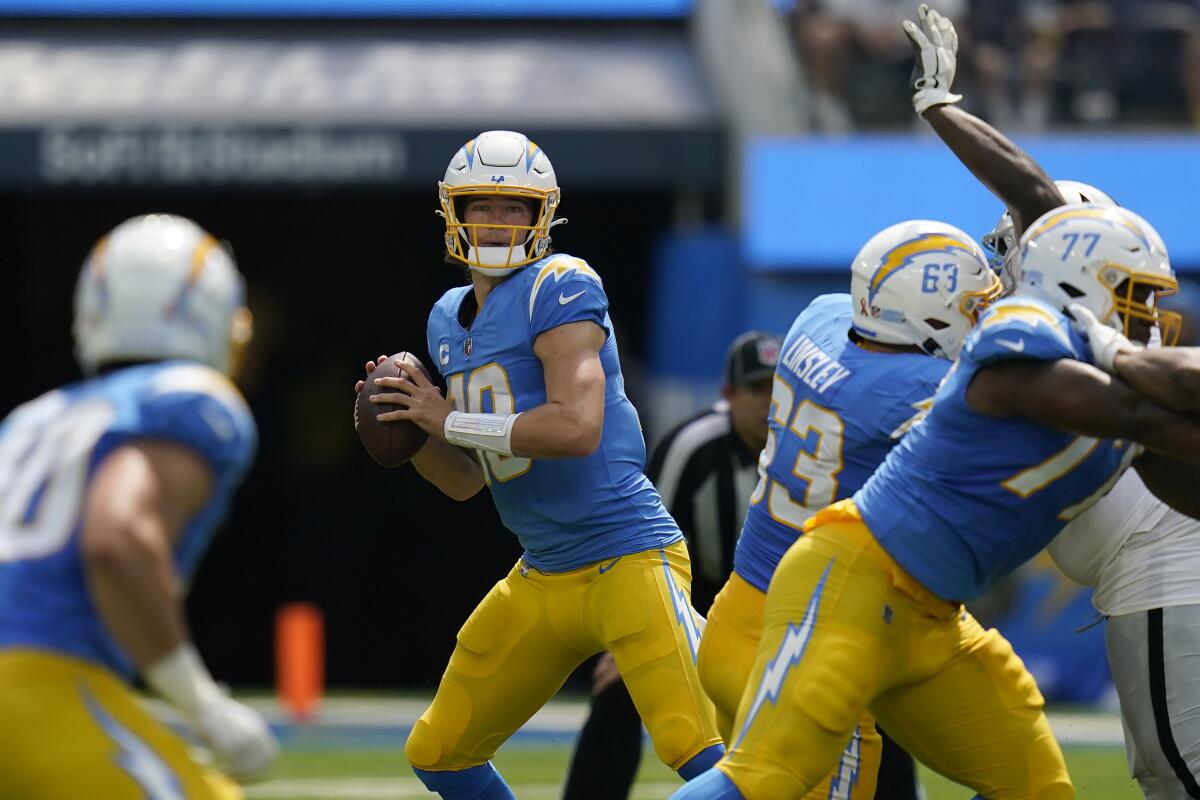 Chargers quarterback Justin Herbert looks to pass against the Las Vegas Raiders.