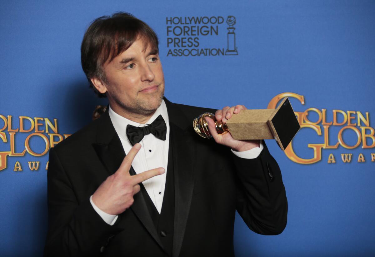 Director Richard Linklater with his Golden Globe trophy.