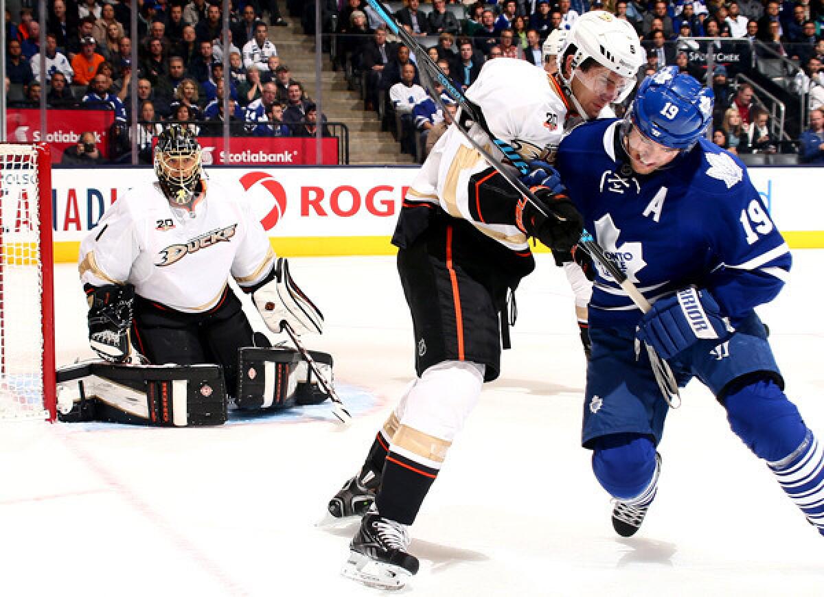 Ducks defenseman Luca Sbisa battles Joffrey Lupul for position during a game earlier this month.