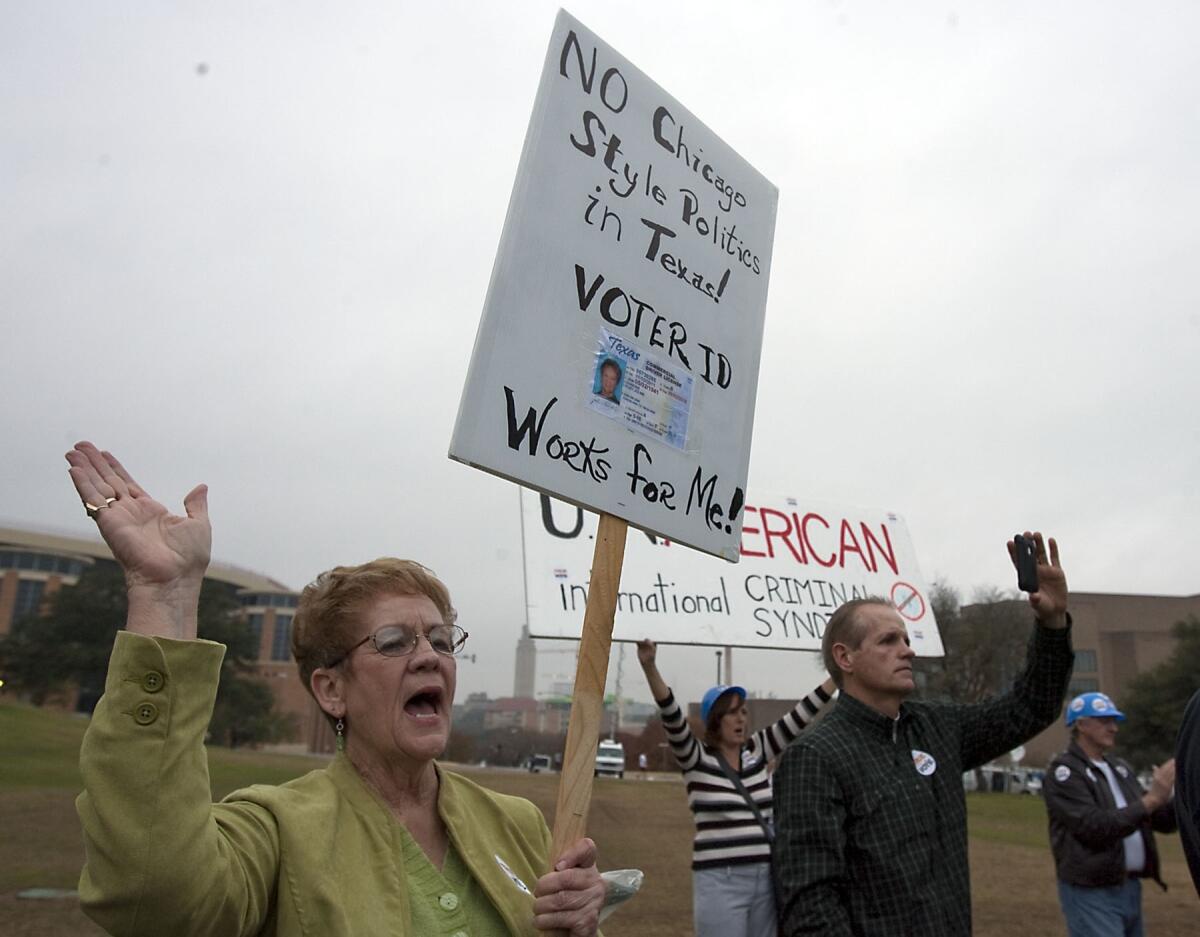 Tea party member Jolene Hawkins, left, of Kingsland, Texas, understands what voter suppression is all about.