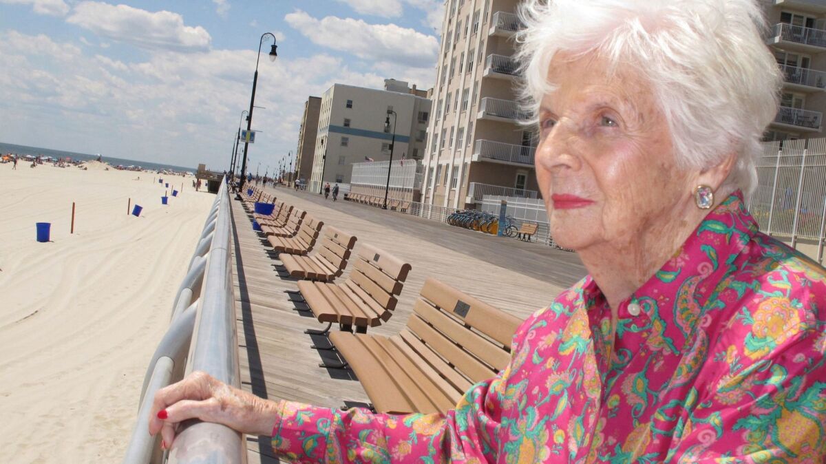 Lucille Horn stands on the boardwalk outside her home in Long Beach, N.Y., in 2015.