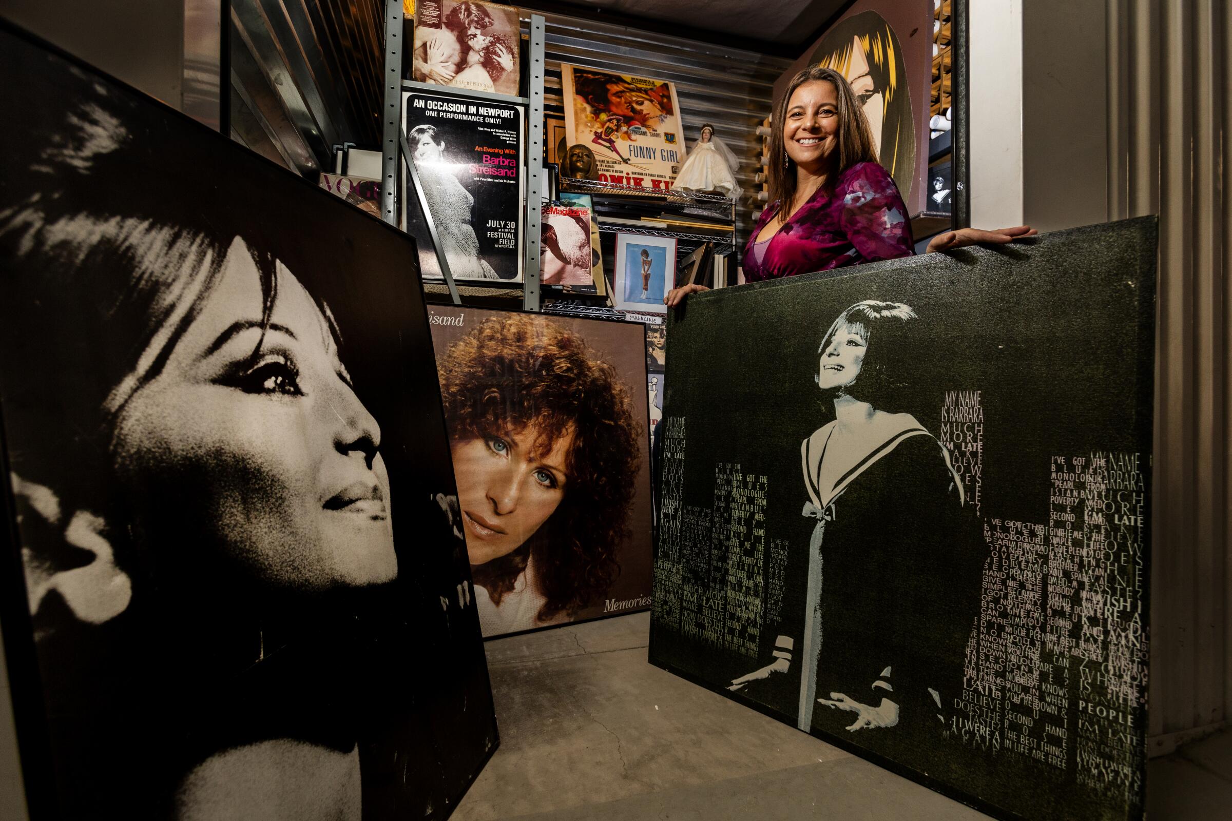 Mara Papalas stands amidst just some of the hundreds of Barbra Streisand memorabilia inside a storage container.
