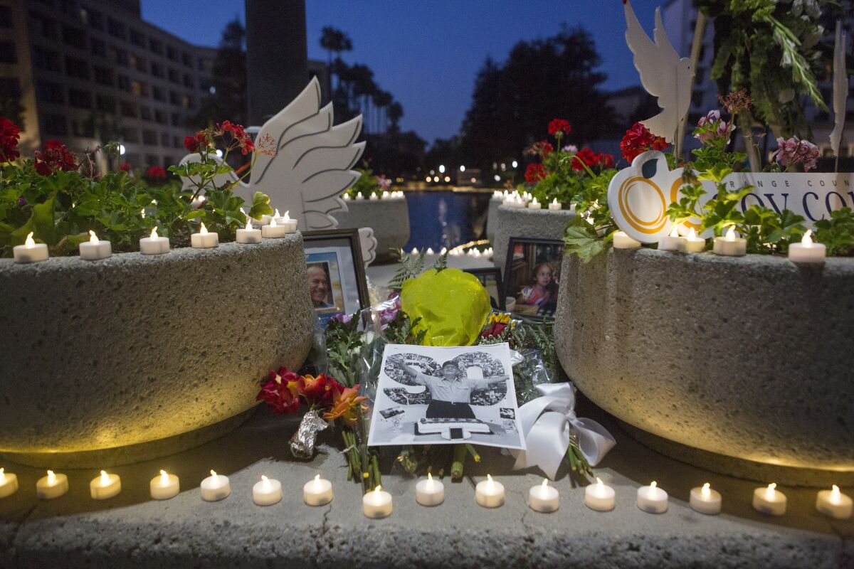 A public candlelight memorial for the Orange County COVID-19 victims hosted by O.C. Supervisor Katrina Foley 