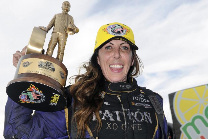 Alexis DeJoria celebrates her first funny car victory Feb. 23, 2014, in Phoenix, Ariz.
