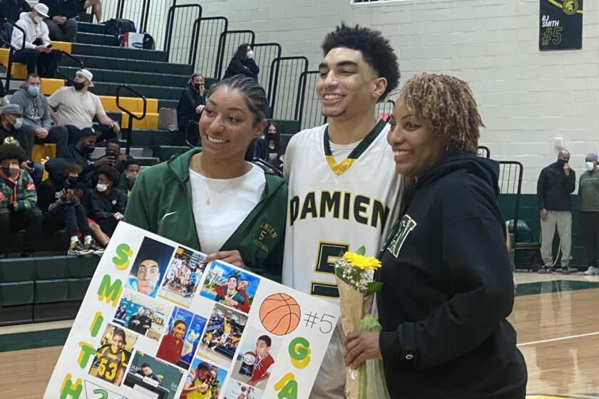 RJ Smith of Damien surrounded by sister Kennedy, a star player at Etiwanda, and mother Monica.