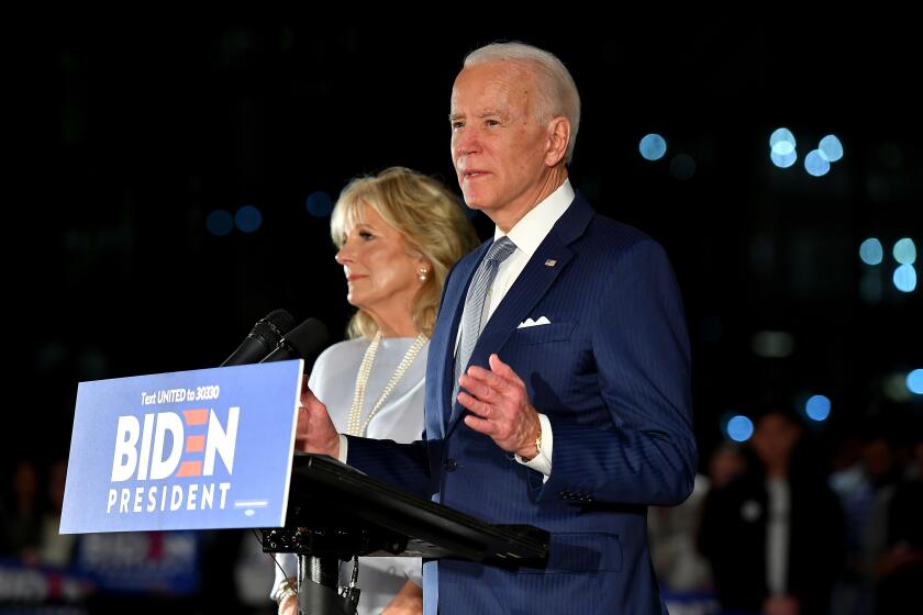 Former Vice President Joe Biden speaks, flanked by his wife Jill Biden, at the National Constitution Center in Philadelphia, Penn. on Tuesday night.