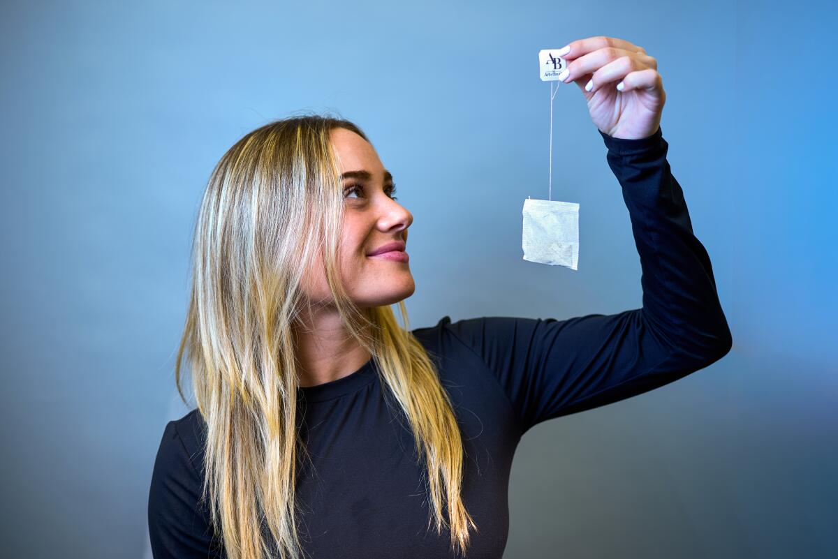 Art of Broth CEO Sophie Helfend holds one of their plant-based broth tea bags.