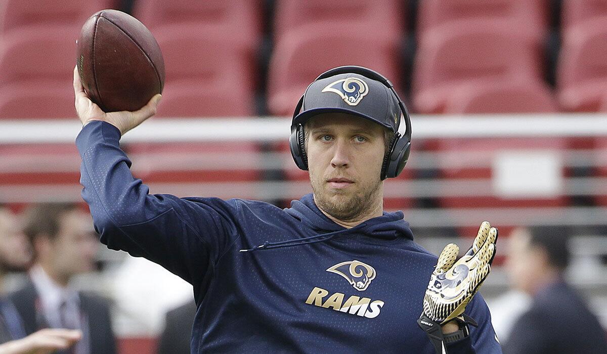 Nick Foles warms up with the Rams on Jan. 3.