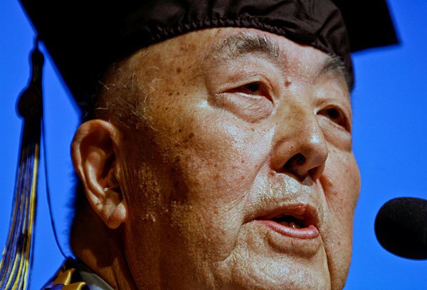 Fumio Robert Naka delivers a speech at the graduation ceremony. Naka, 86, who was a UCLA student when he was sent to the Manzanar internment camp in the Owens Valley, said the experience taught a lesson in how humans can persevere when confronted with events "beyond our control."