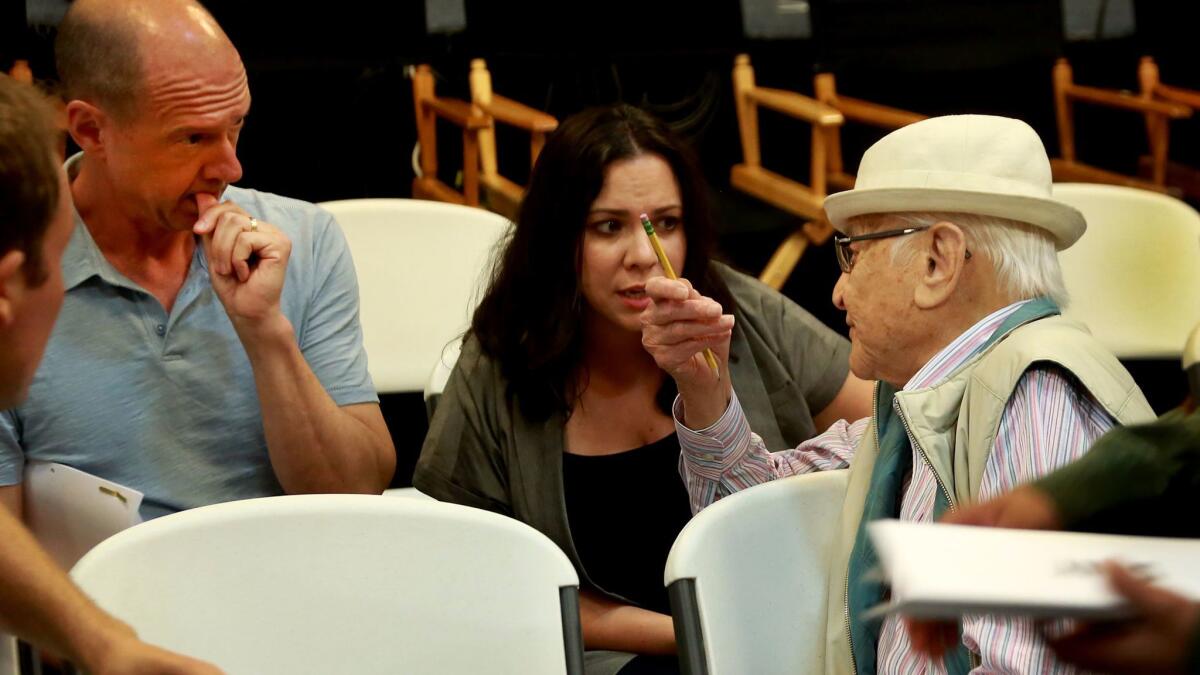 Table read of Netflix's all-Latino update of "One Day at a Time." TV legend Norman Lear (in white hat) talks with show runners Mike Royce and Gloria Calderon Kellett.
