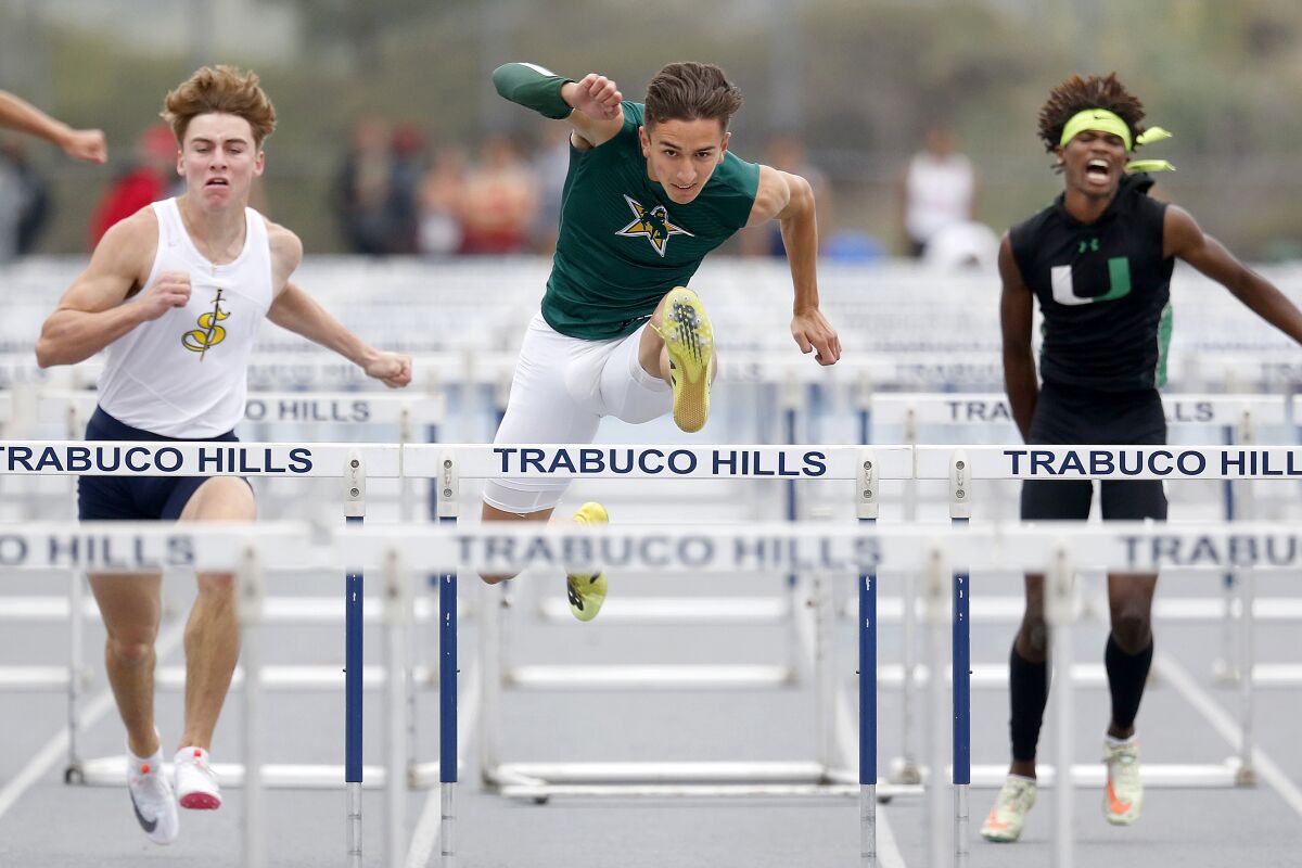 Seth Johnson competes in the 110-meter hurdles at the Trabuco Hills Invitational on Saturday.