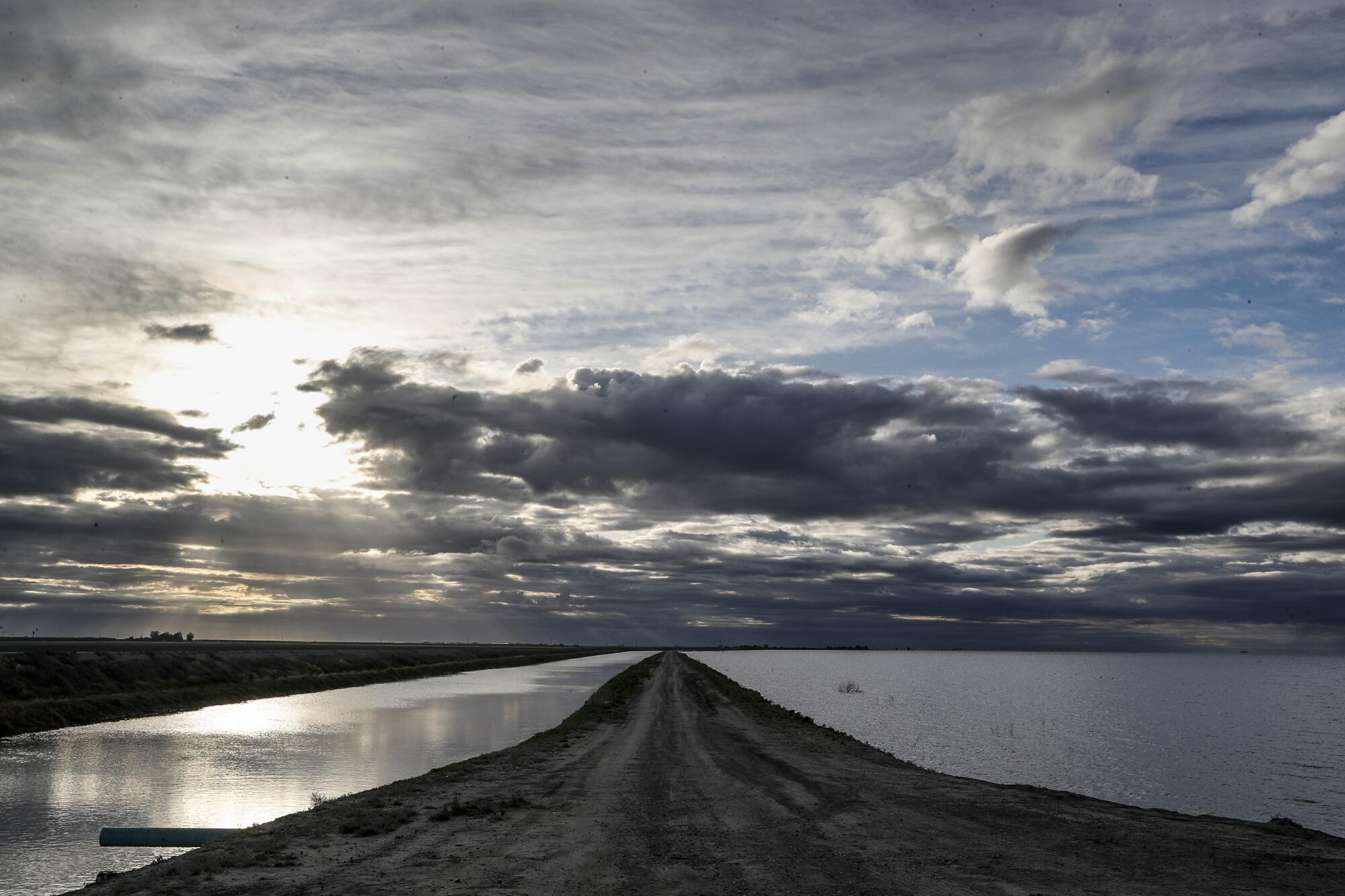 A swollen Kings River, left, drains into the newly risen Tulare Lake.