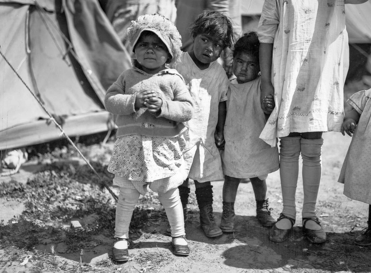 March 1928: Child survivors at a relief camp after the failure of the St. Francis Dam.