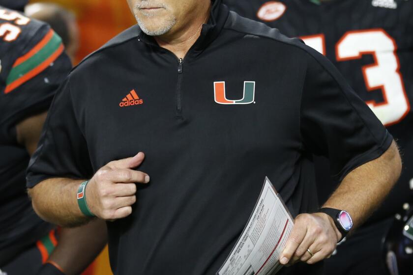 FILE - In this Dec. 30, 2017, file photo, Miami head coach Mark Richt enters the field during the second half of the Orange Bowl NCAA college football game against Wisconsin, in Miami Gardens, Fla. Some traditional recruiting heavyweights have plenty of work to do in the next several weeks to sign the level of talent they usually attract each year. As college footballâ€™s early signing period concluded Friday, Southern California was outside the top 20 and Miami wasnâ€™t in the top 30 of the team standings in composite rankings of recruiting sites compiled by 247Sports. (AP Photo/Joe Skipper, File)