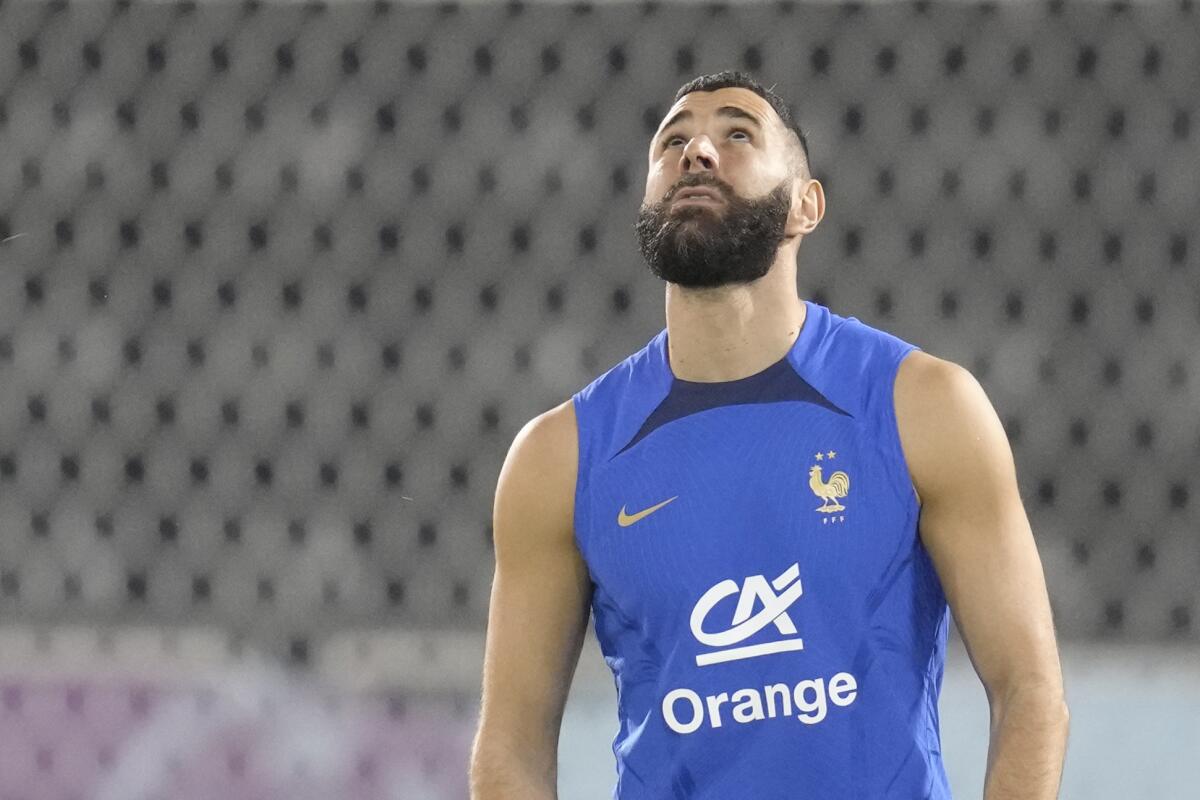 France's Karim Benzema watches the ball during a training session at the Jassim Bin Hamad stadium in Doha, Qatar, Saturday, Nov. 19, 2022. France will play their first match in the World Cup against Australia on Nov. 22. (AP Photo/Christophe Ena)