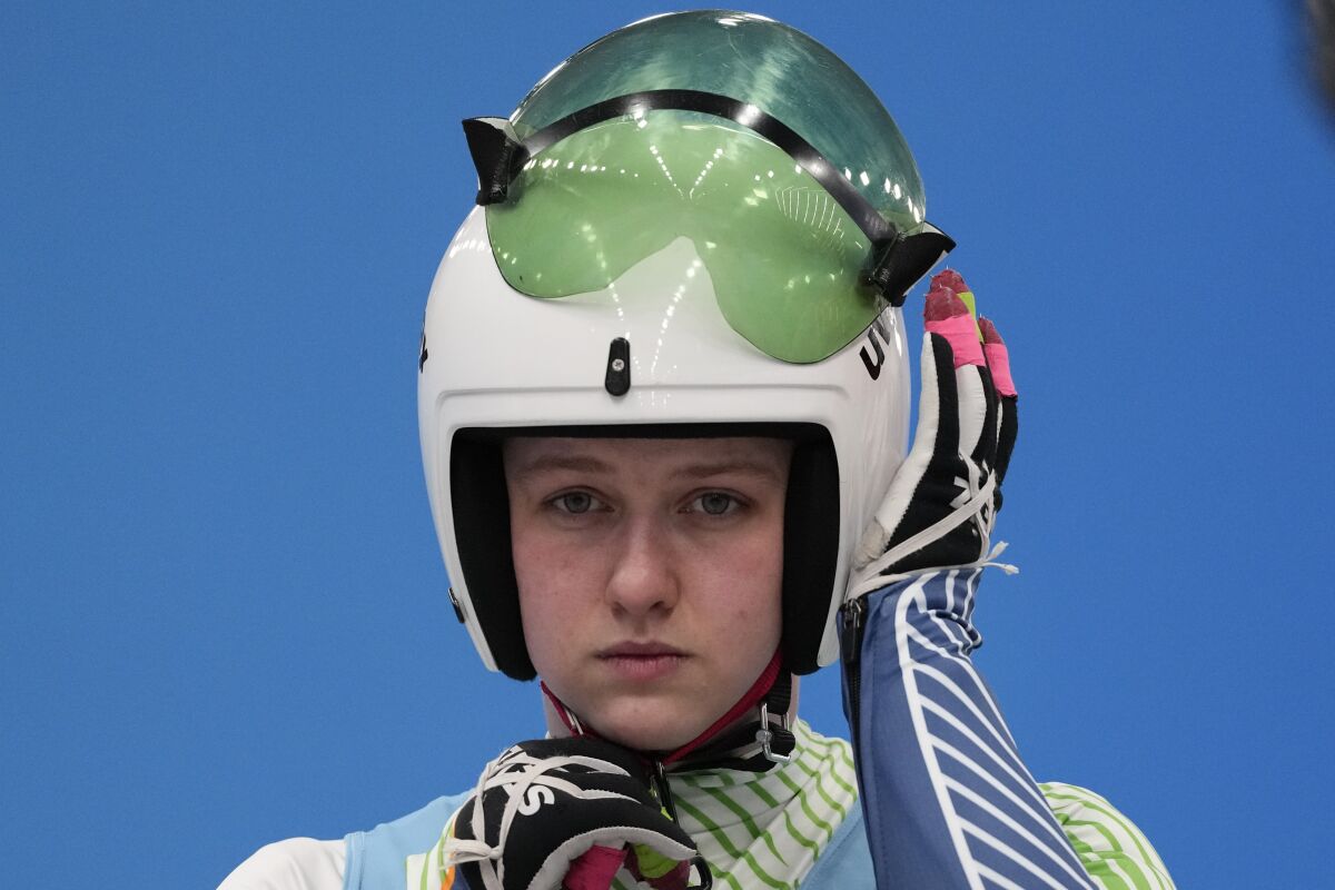 Elsa Desmond, of Ireland, prepares to start for the luge women's singles run 1 at the 2022 Winter Olympics, Monday, Feb. 7, 2022, in the Yanqing district of Beijing.(AP Photo/Mark Schiefelbein)