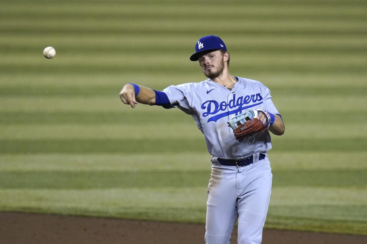 Dodgers second baseman Gavin Lux throws.