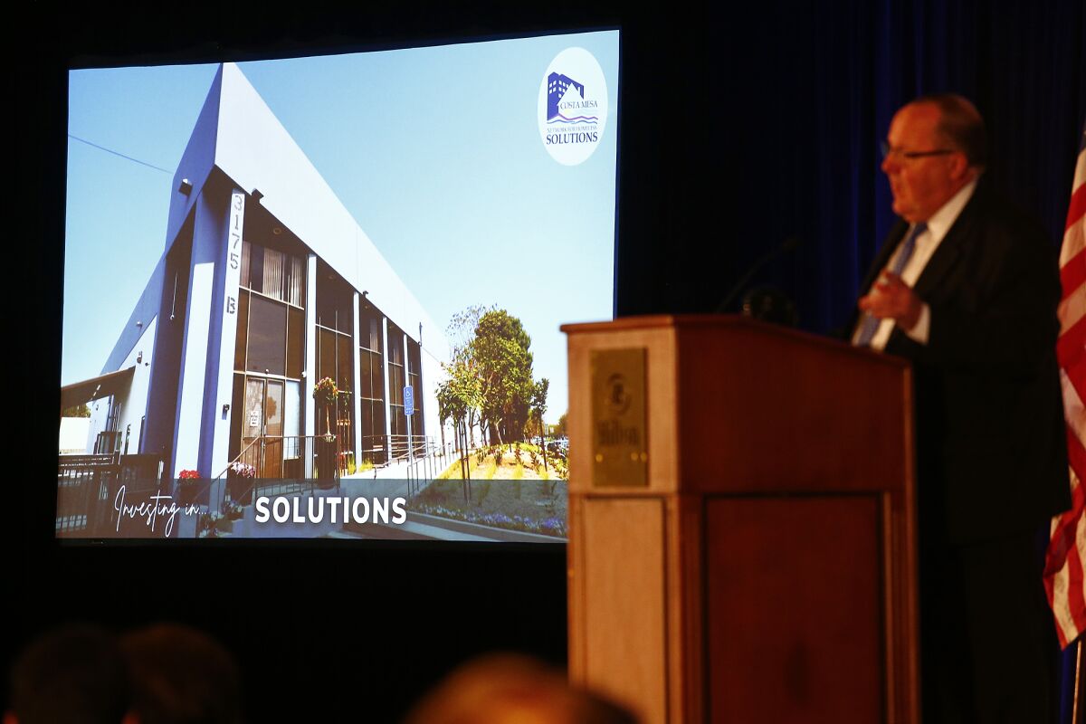 Mayor John Stephens before a picture of the city's permanent bridge shelter Friday at an annual State of the City luncheon.