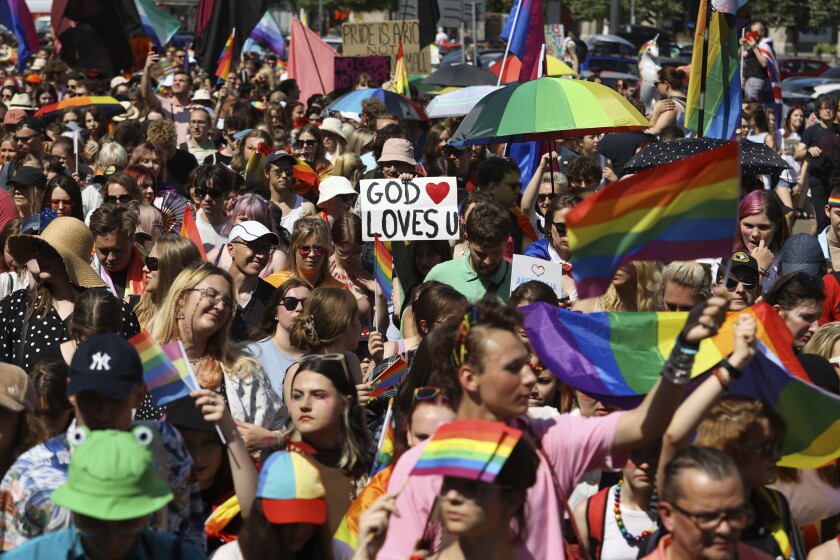 People take part in the 'Warsaw and Kyiv Pride' marching for freedom in Warsaw, Poland, Saturday, June 25, 2022. Due to Russia's full-scale war against Ukraine the 10th anniversary of the equality march in Kyiv can't take place in the usual format in the Ukrainian capital. The event joined Warsaw's yearly equality parade, the largest gay pride event in central Europe, using it as a platform to keep international attention focused on the Ukrainian struggle for freedom. (AP Photo/Michal Dyjuk)