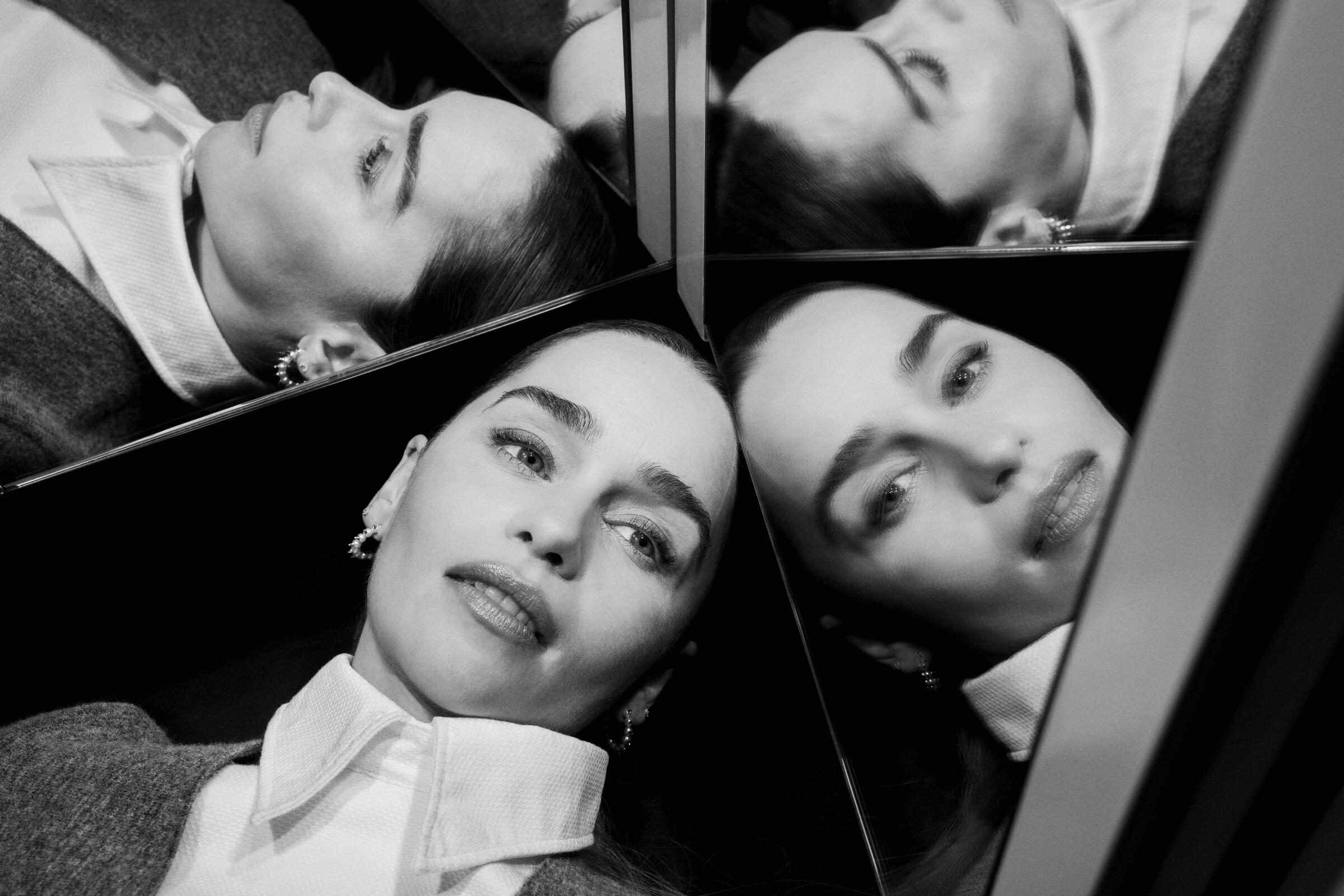 Emilia Clarke surrounded by her reflection in mirrors