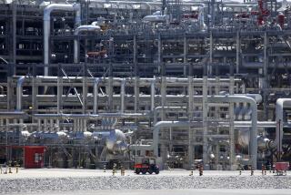 A small vehicle drives past a network of piping that makes up pieces of a "train" at Cameron LNG export facility in Hackberry, La., on Thursday, March 31, 2022. Natural gas is cooled at the facility and turned into liquid and sent on massive ships to many parts of the world. Once it arrives at its destination, the liquified natural gas is re-gasified and piped to homes, factories and other places. Demand for natural gas worldwide has been greater than ever since Russia, another major natural gas exporter, invaded Ukraine. (AP Photo/Martha Irvine)