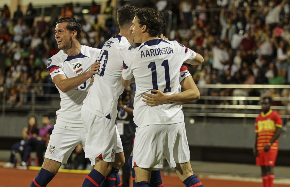 U.S. players celebrate their goal against Grenada during a CONCACAF Nations League soccer match.