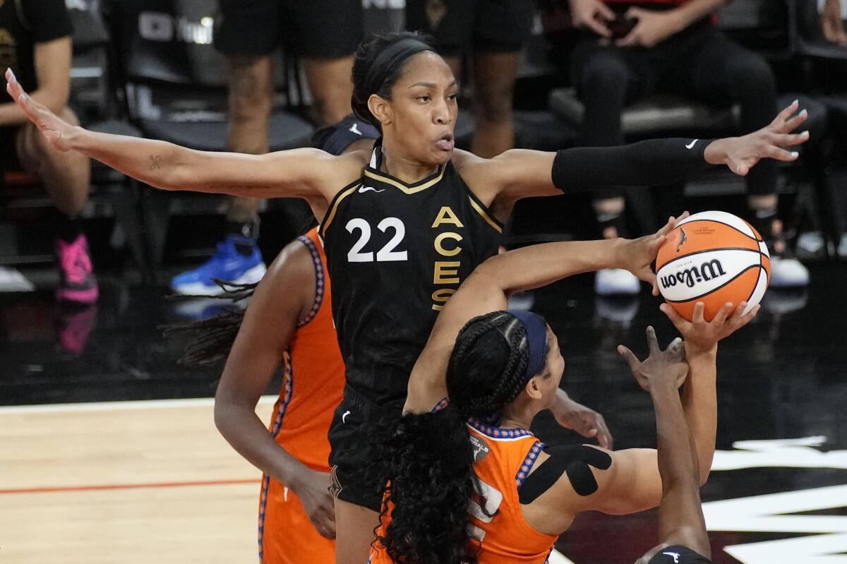 Las Vegas Aces forward A'ja Wilson guards Connecticut Sun center Brionna Jones.