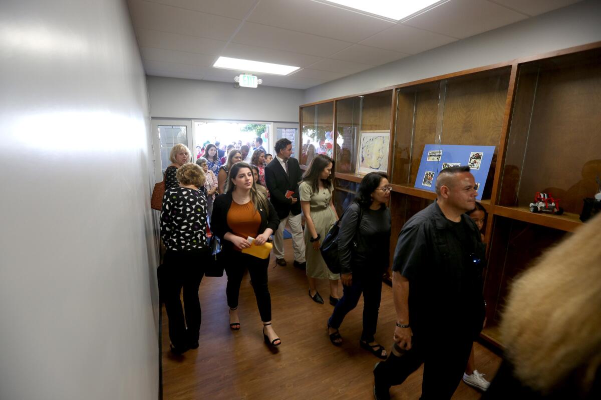 Parents and guests enter the new St. John Paul II STEM Academy at Bellarmine-Jefferson in Burbank on Tuesday.
