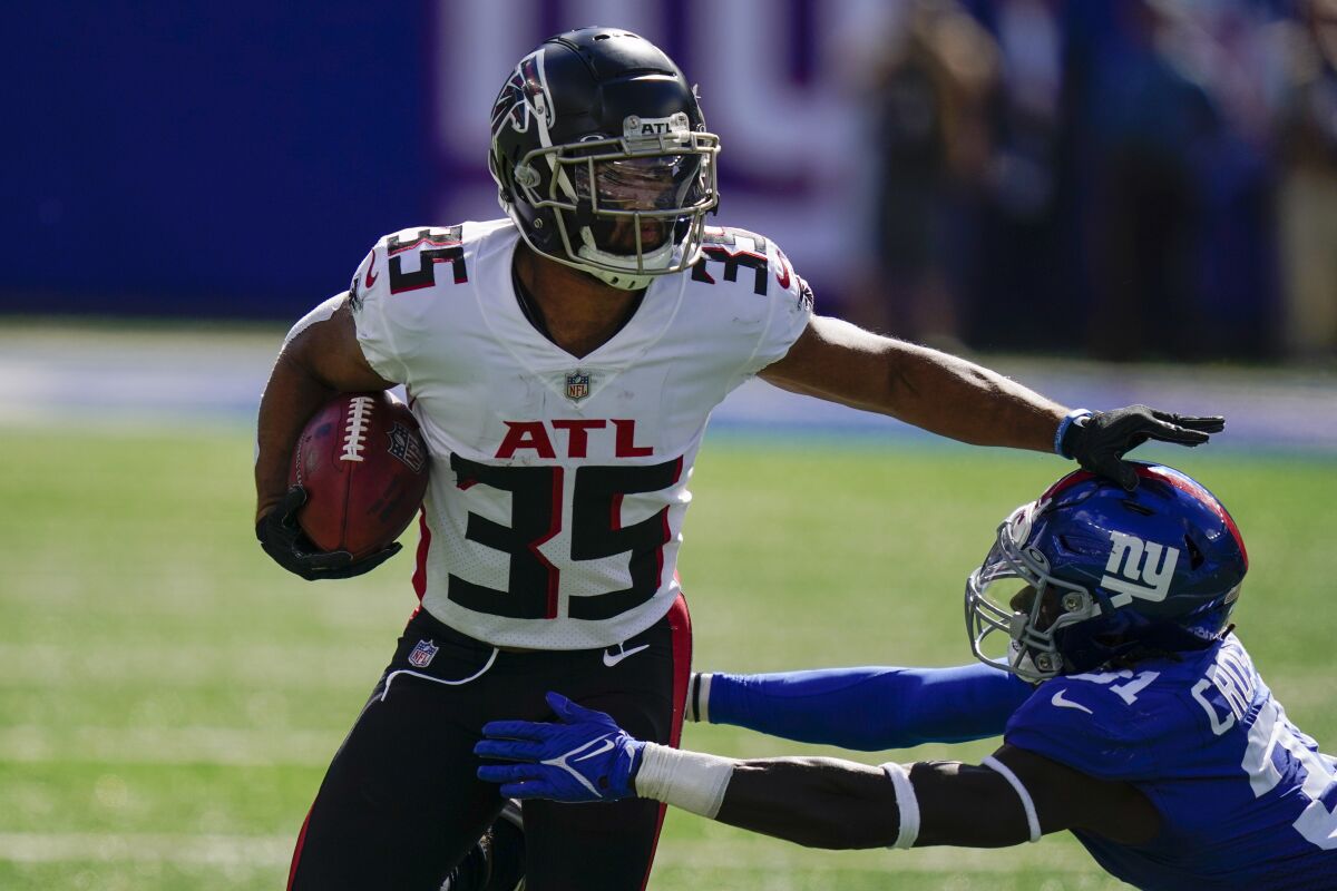 Atlanta Falcons cornerback Avery Williams (35) runs the ball against New York Giants defensive back Keion Crossen (31) during the first half of an NFL football game, Sunday, Sept. 26, 2021, in East Rutherford, N.J. (AP Photo/Seth Wenig)