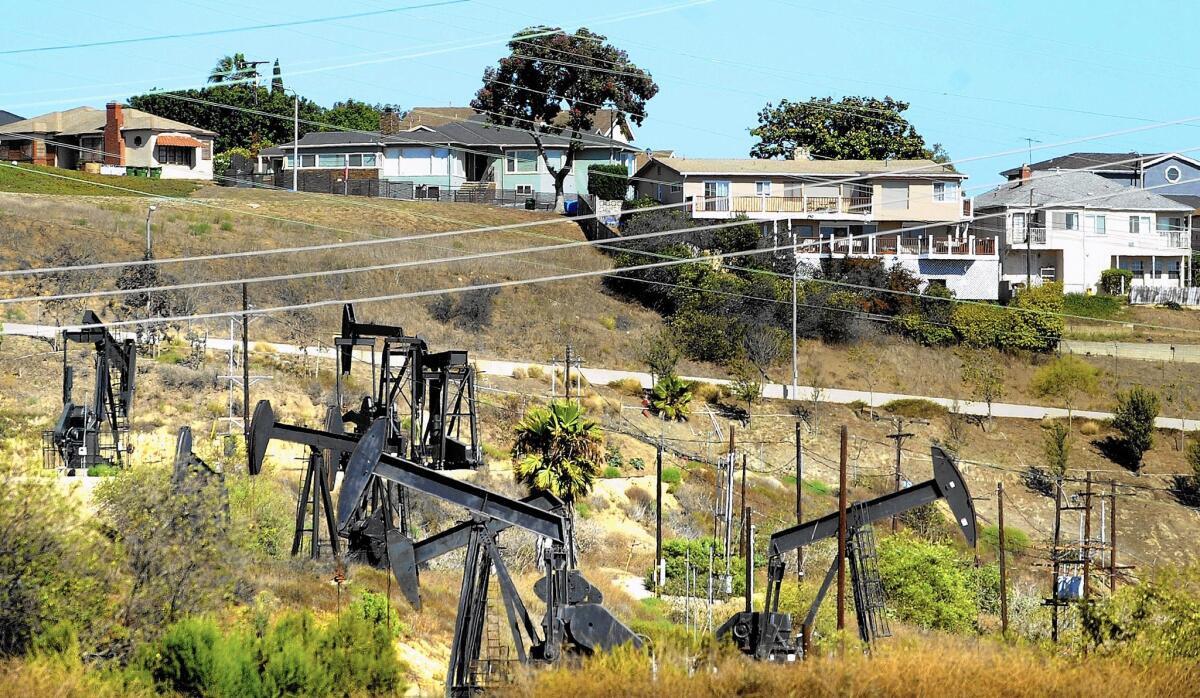 Oils wells operate near homes in Los Angeles. 