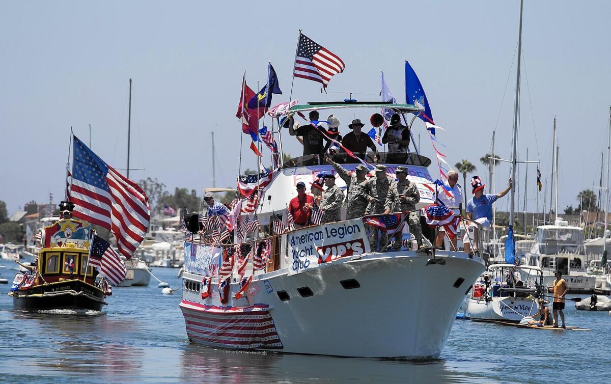 An American Legion Yacht Club vessel sails in the 2014 Old Glory Boat Parade. 
