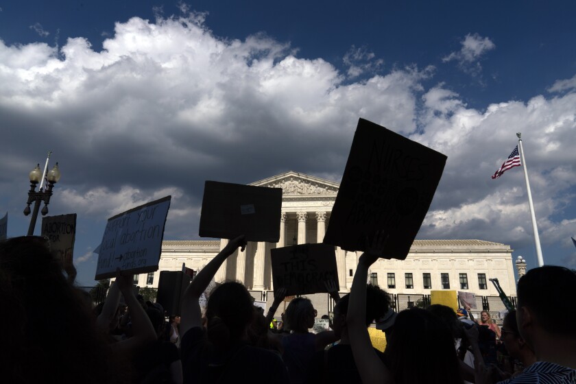 Abortion-rights activists protest outside the Supreme Court in Washington on Saturday.