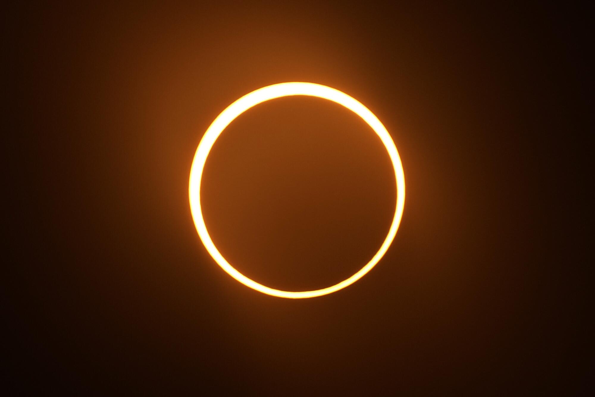 The moon moves in front of the sun during an annular solar eclipse, or ring of fire.