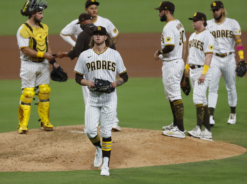 Chris Paddack of the San Diego Padres walks off after getting pulled from the game
