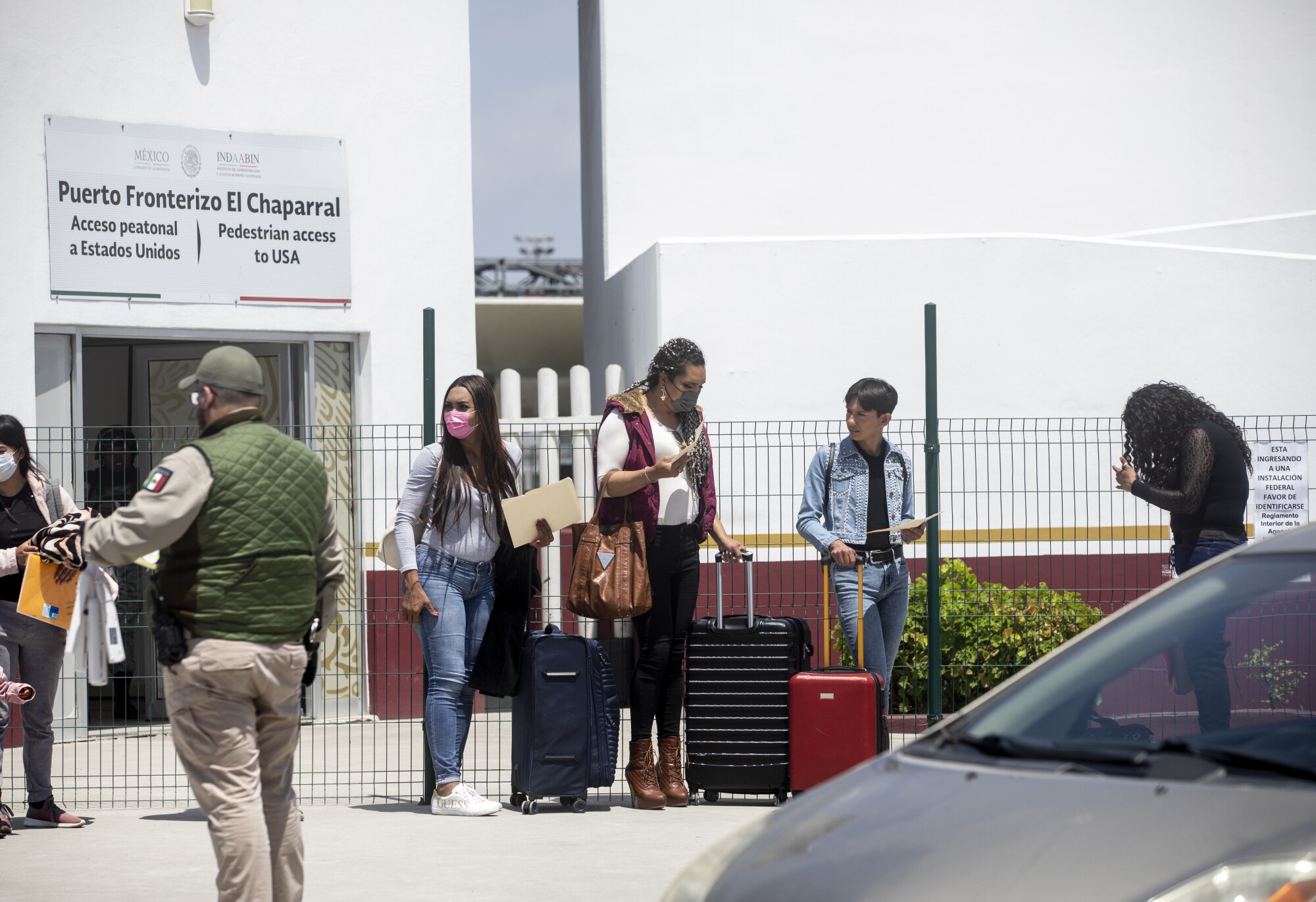 Zethare waits to walk into the western entrance of the main port of entry