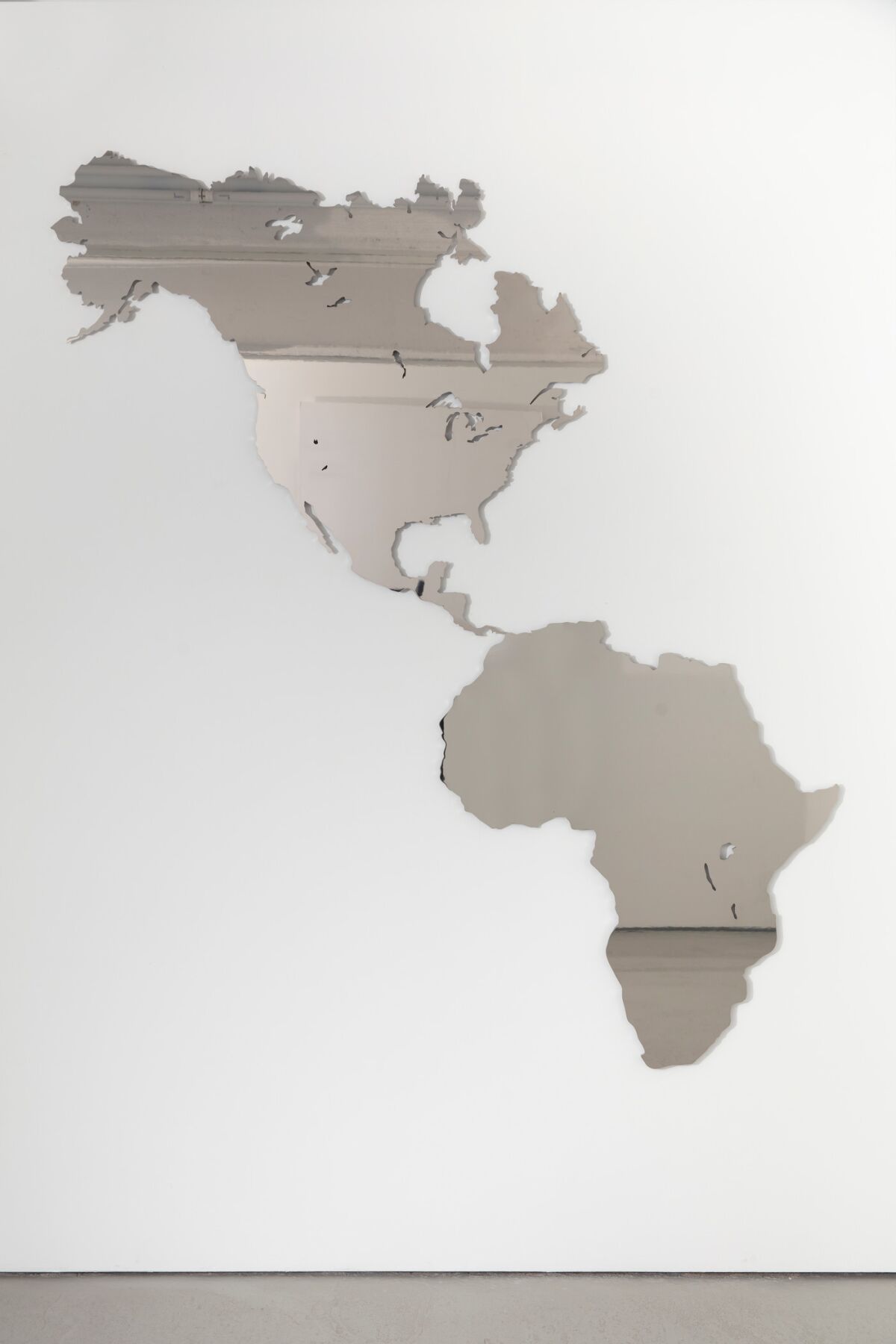 Mirror cutout of the americas with South America being the shape of Africa, 
