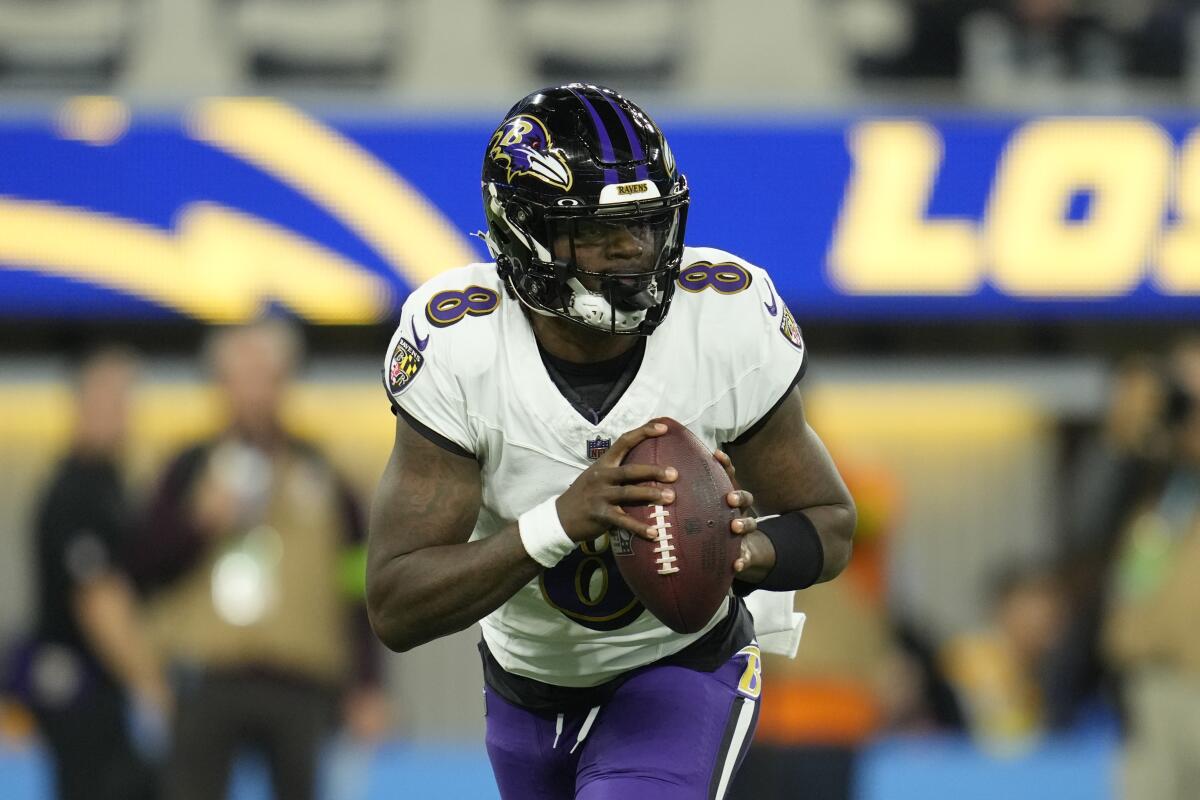 Baltimore Ravens quarterback Lamar Jackson (8) looks for a receiver.
