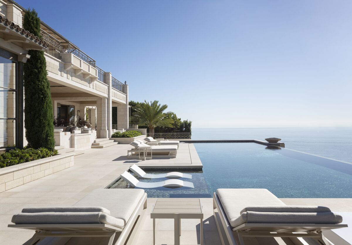 An infinity-edge swimming pool overlooking the ocean