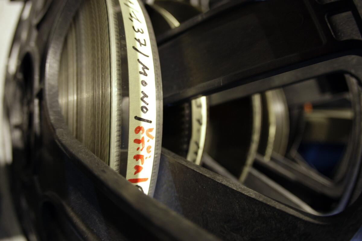 A 35mm film is stacked up on its reel.