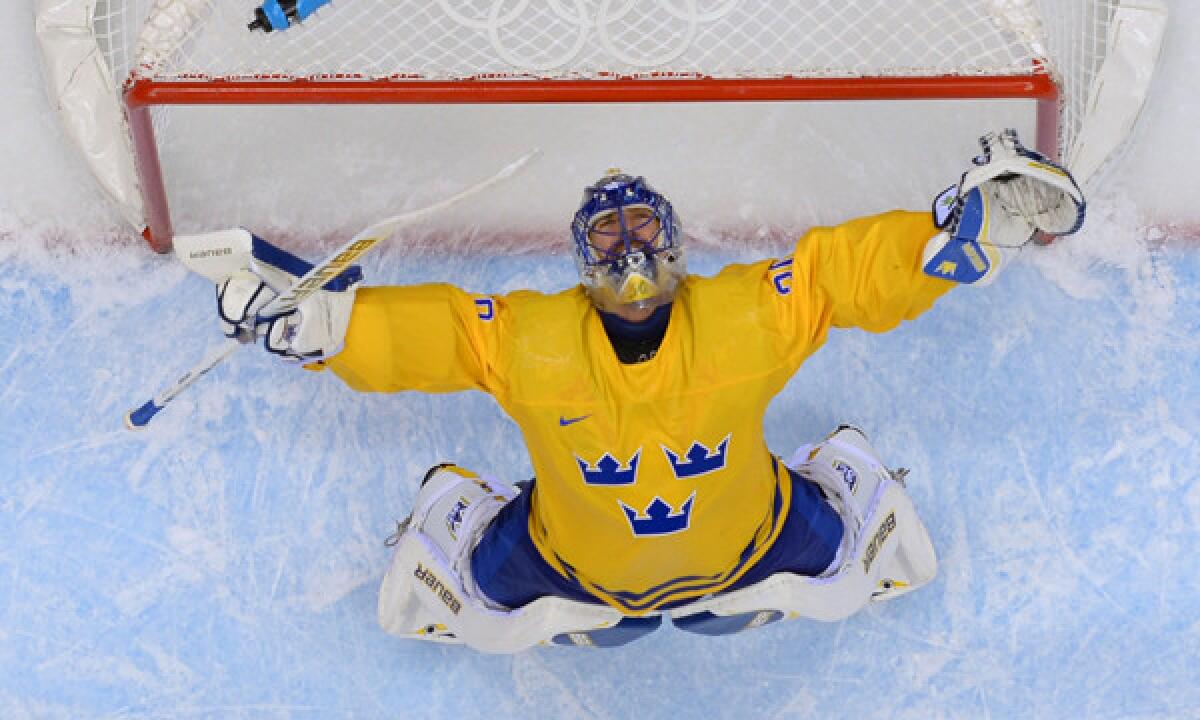 Sweden goalie Henrik Lundqvist celebrates at the end of a 2-1 victory over Finland in the quarterfinals at Sochi Winter Olympic Games on Friday. Sweden will play Canada in the gold-medal game Sunday.