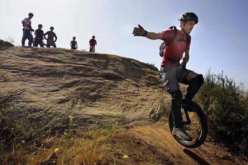 BALANCED: With an arm out and a hand on the grip, Eyal Aharoni of Santa Barbara rides down. "If you're not really coordinated, don't unicycle," he advises.