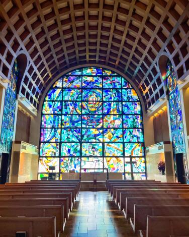 Stained glass shines inside Stauffer Chapel at Pepperdine University.