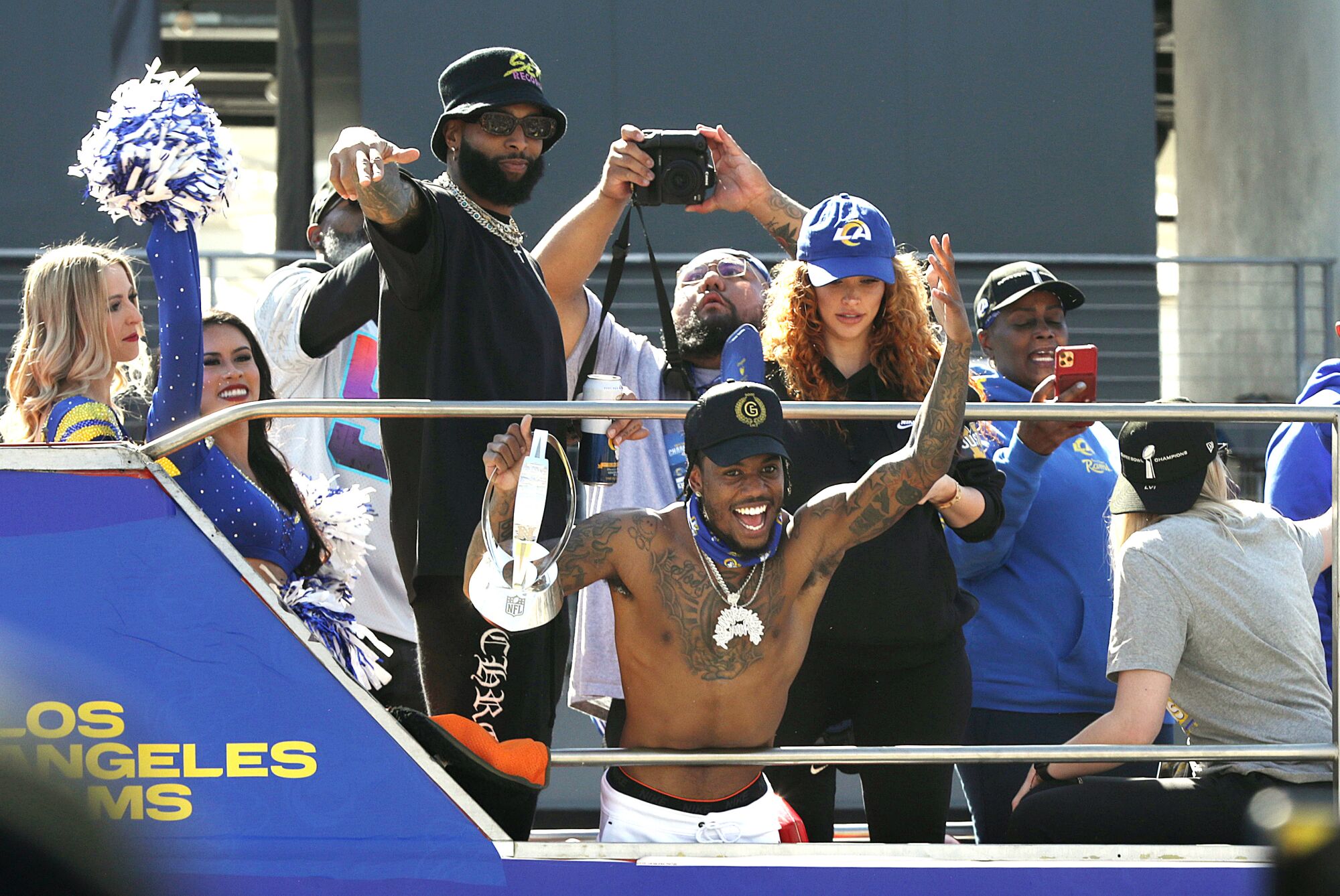 The Rams celebrate with fans during their victory parade in Los Angeles.