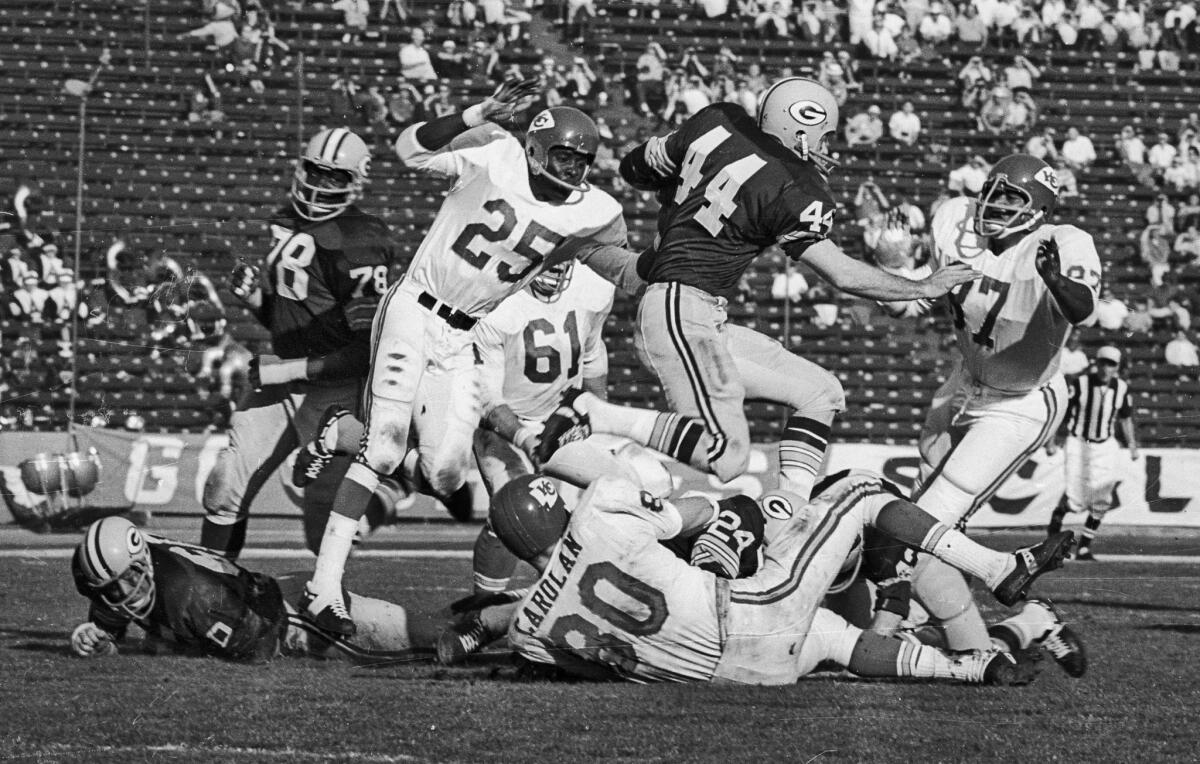 Jan. 15, 1967: Packers halfback Donny Anderson, 44, running against Chiefs' Frank Pitts, 25, Denny Biodrowski, 61, Reg Carolan and Aaaron Brown, 87. Packers' Bob Brown, 78, is on left.