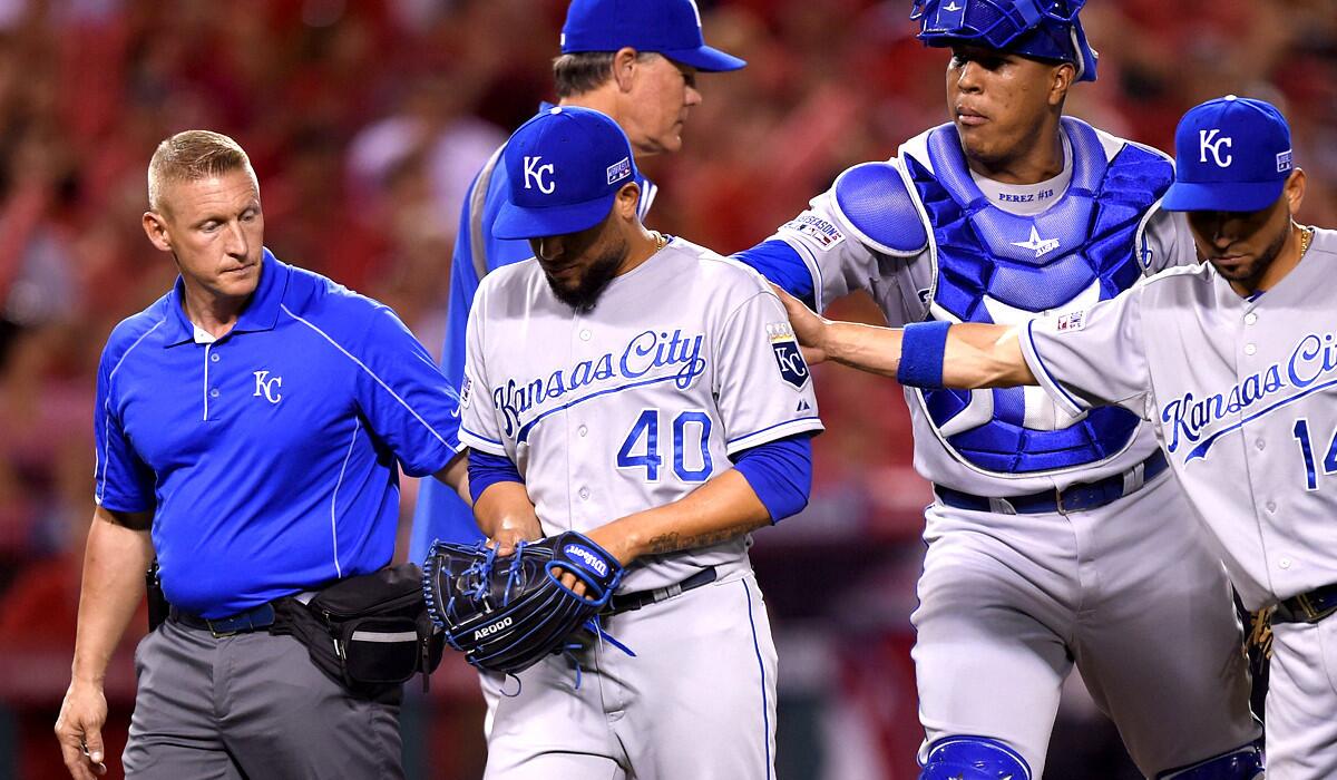 Royals relief pitcher Kelvin Herrera is helped off the field in the seventh inning Thursday night after injuring his forearm.
