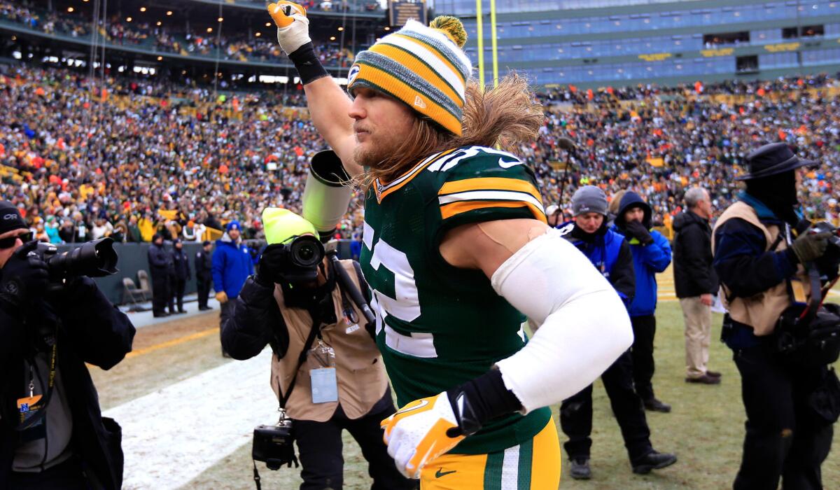 Packers linebacker Clay Matthews acknowledges the fans after a 26-21 victory over the Dallas Cowboys in an NFC divisional playoff game Sunday in Green Bay.
